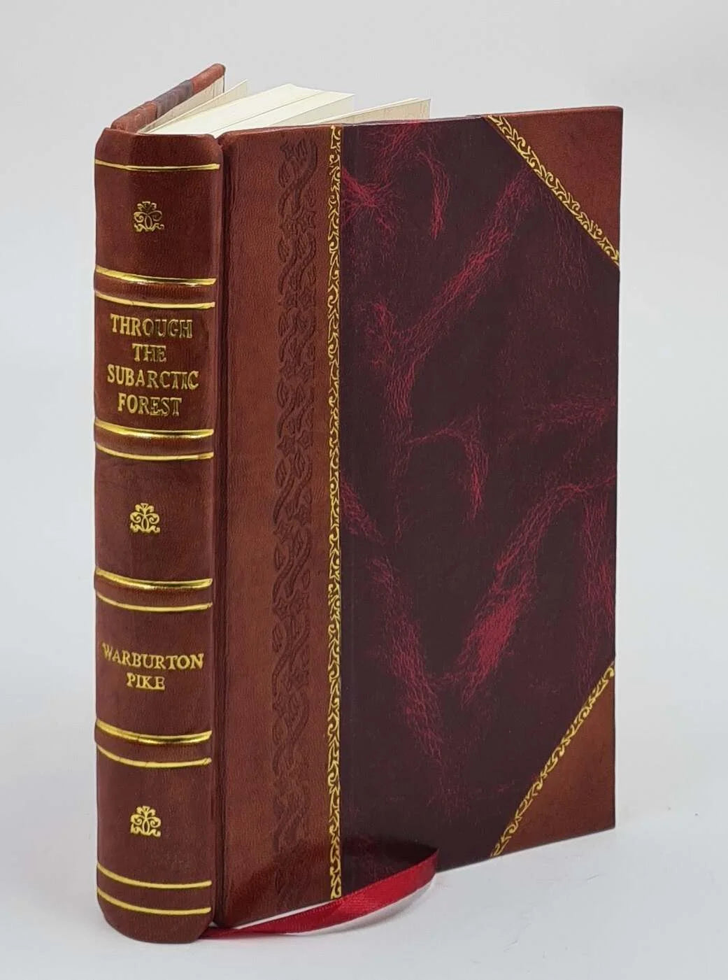 Through the subarctic est A record of a canoe journey from Fort Wrangel to the Pelley lakes and down to the Yukon River to the Behring Sea 1896 [Leather Bound]